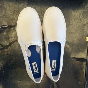 Keds white canvas slip ons